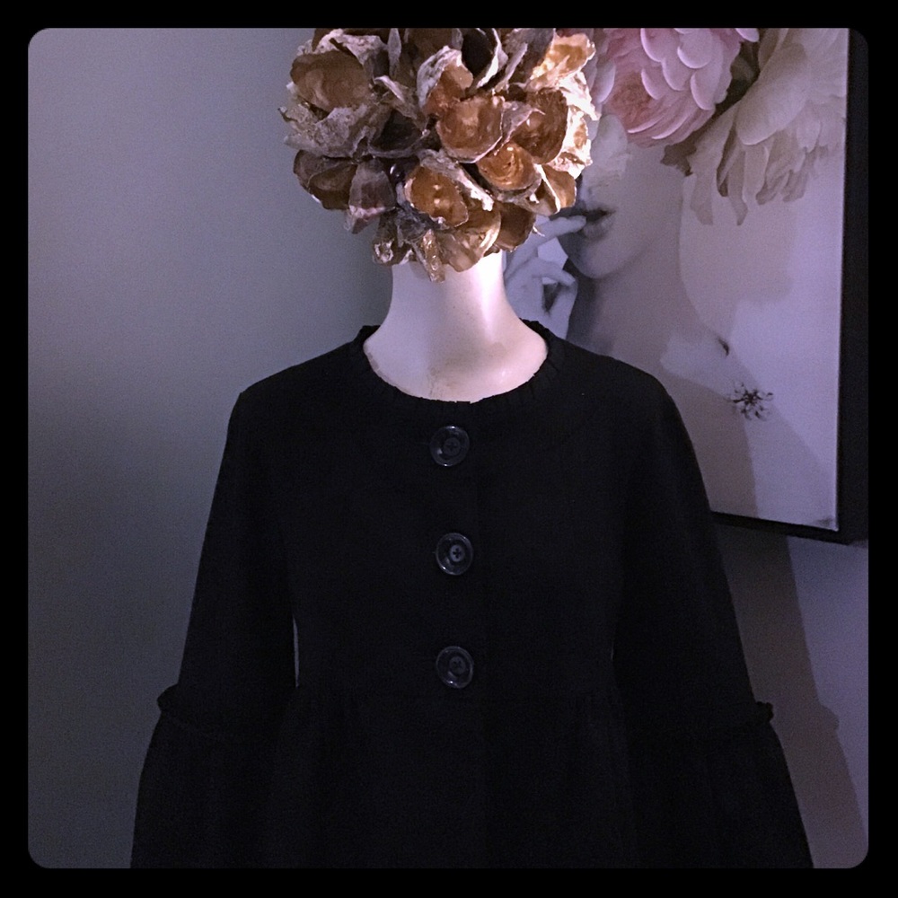 Peplum jacket with demure ruffle trim